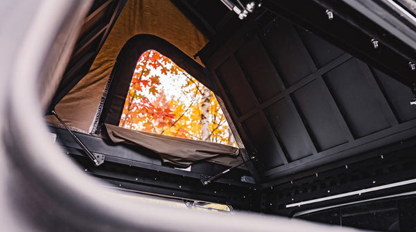 Interior pass-through from the truck cap up into the roof tent