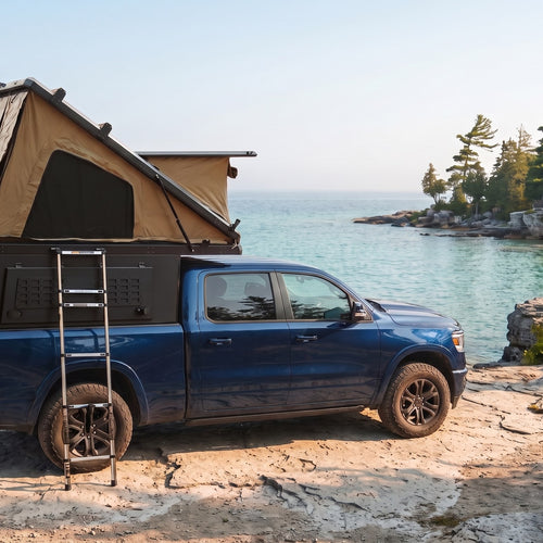 Ram 1500 Double Pop-Up truck cap camper with the roof tent open on the Georgian Bay shoreline in Ontario