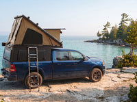 Ram 1500 Double Pop-Up truck cap camper with the roof tent open on the Georgian Bay shoreline in Ontario
