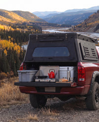 Tailgate camp kitchen under the rear hatch of a Dodge Ram 2500/3500 truck bed camper