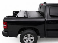 Flip-back cover folded toward the cab for full bed access — RAM 1500 — view 11