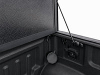 Latch mechanism, drain tube and prop rod detail inside the bed — view 17