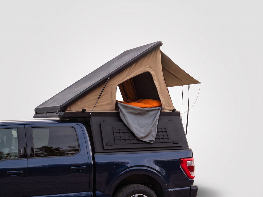 Single Pop-Up truck cap camper on a Ford F-150, shown for comparison with the Double Pop-Up