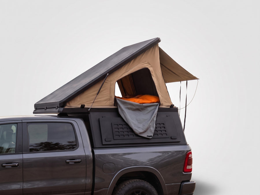 Single Pop-Up truck cap camper on a Ram 1500, shown for comparison with the Double Pop-Up