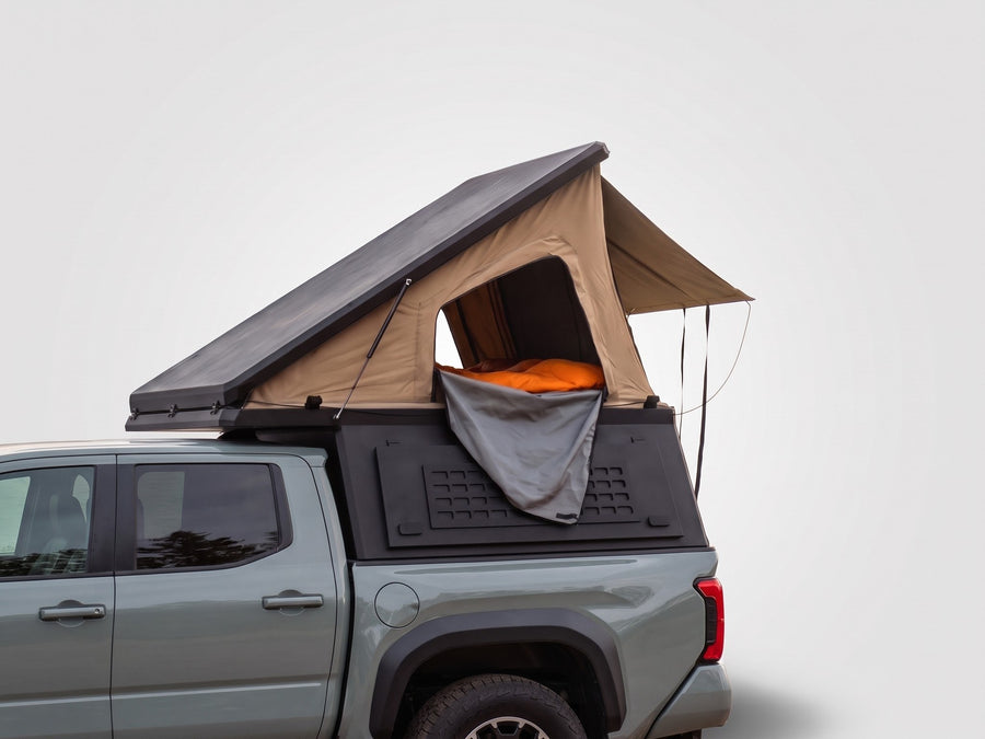 Single Pop-Up truck cap camper on a Toyota Tacoma, shown for comparison with the Double Pop-Up