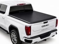 TruckTon soft tri-fold tonneau cover closed on a GMC — low flush profile — view 1