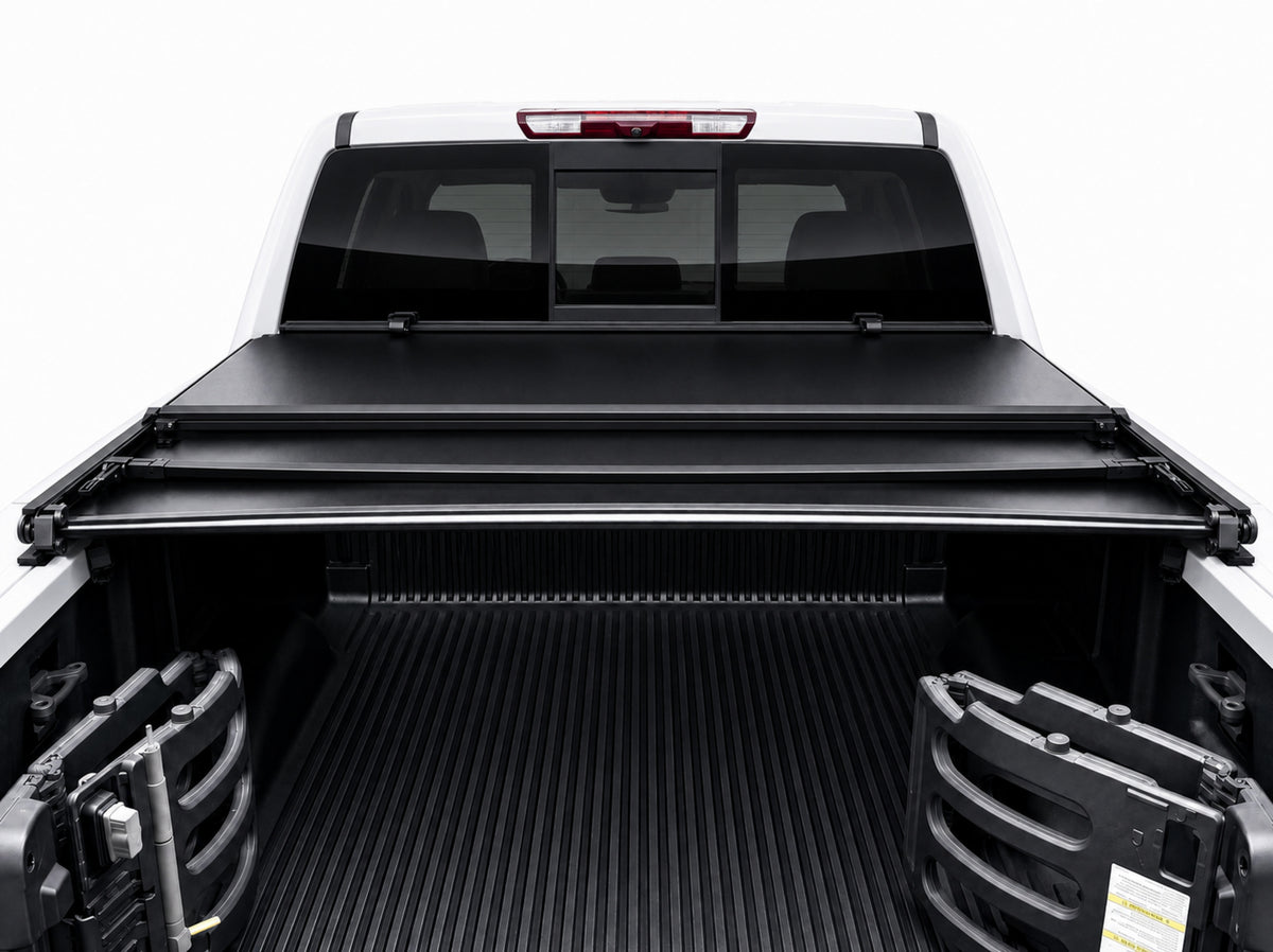 Soft tri-fold cover folded open showing full bed access