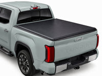 TruckTon soft tri-fold tonneau cover closed on a Toyota — low flush profile — view 1