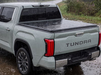 Soft tonneau cover shedding heavy rain — view 15