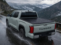Sealed flip-back cover in heavy rain — Toyota Tundra — view 17