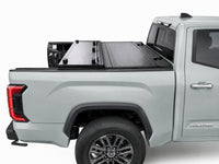 Flip-back cover folded toward the cab for full bed access — Toyota Tundra — view 10