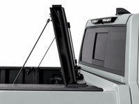 Cover folded fully upright against the cab with prop rods — Toyota Tundra — view 11