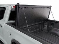 Propped-open panel showing gas struts and bed access — Toyota Tundra — view 15