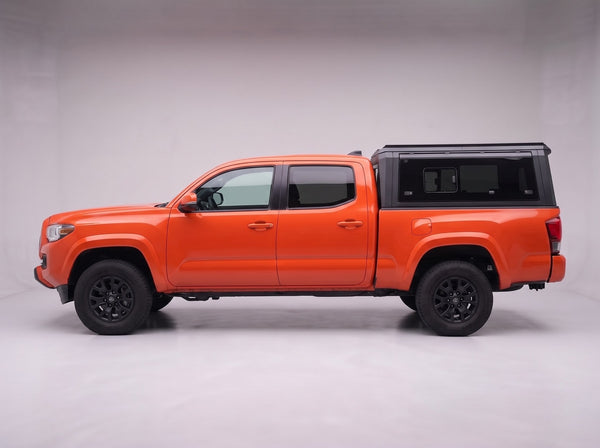 Side profile of the truck cap on a Toyota Tacoma, following the cab lines