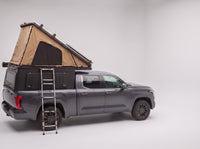 Step 2, main roof up: the roof tent open with the second hatch still closed, on a Toyota Tundra
