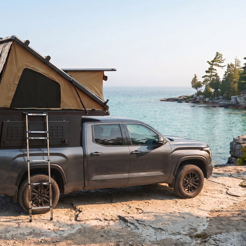 Toyota Tundra Double Pop-Up truck cap camper with the roof tent open on the Georgian Bay shoreline in Ontario