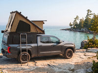 Toyota Tundra Double Pop-Up truck cap camper with the roof tent open on the Georgian Bay shoreline in Ontario