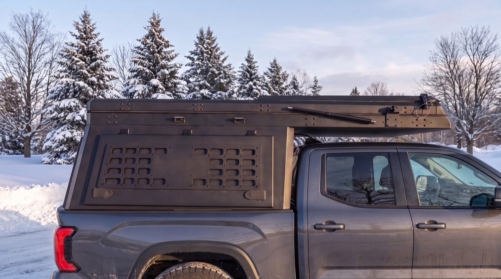 Toyota Tundra truck cap camper closed up for winter driving on a snowy Ontario road