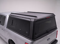 Roof rail and LED third brake light on the matte black aluminum truck cap