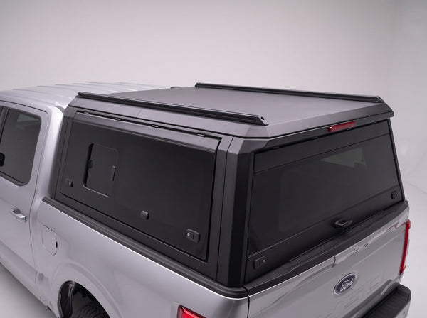 Roof rails and LED third brake light on the matte black truck cap